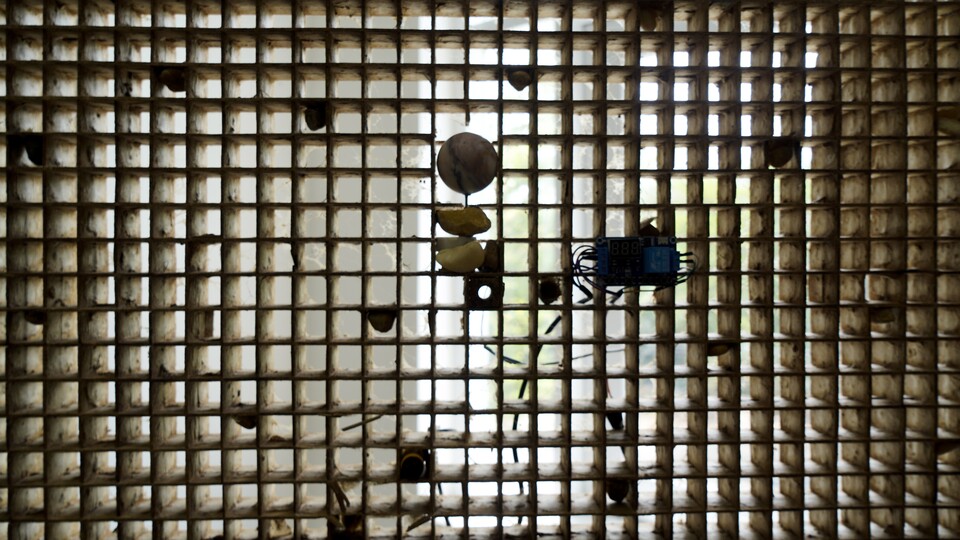 Truong Công Tùng, In the cyclical play of opposites…, 2025 – ongoing, Detail: Rock, wood, pine, pebbles, sap, ashes and dust, silkworm cocom’s, time, space, Set of 8 panels, 100 x 100 cm each, Courtesy of the artist